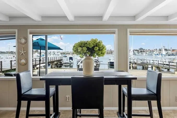 Waterfront Views, Shared Dock, & Short Walk to Beach, Shops, & Surf Edgewater B by Avantstay